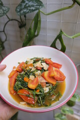 Stir fried water spnach or known as tumis kangkung in Indonesia.