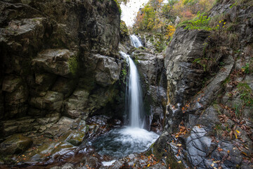 Fototapeta na wymiar Fotinovo waterfalls (Fotinski waterfall) in Rhodopes Mountain, Pazardzhik region, Bulgaria. Amazing autumn landscape