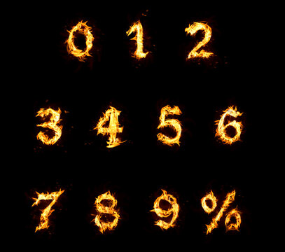 Set of flaming numbers and percent symbol on black background