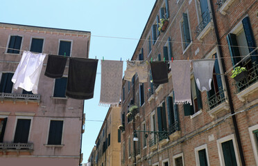 clothes hanging out to dry in a city in Italy