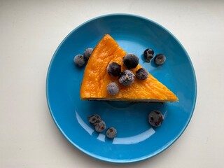 Pumpkin cheesecake on a blue saucer