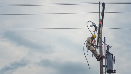 Lineman climb concrete pole and use clamp stick grip all types to connect the single phase...