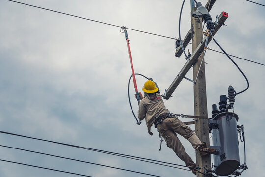 Lineman climb concrete pole and use clamp stick grip all types to connect the single phase transformer to the distribution system.