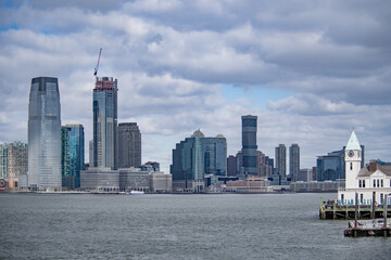 Obraz premium Jersey City modern skyscrapers skyline including from New York Harbor near New York City NYC, New Jersey NJ, USA.