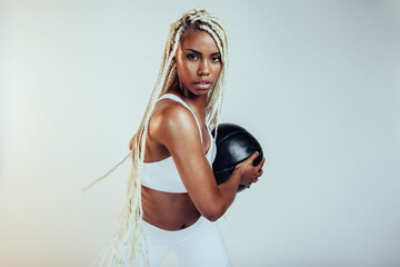 Portrait of fitness woman with medicine ball