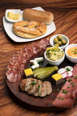 german cold cuts tapas snack platter with meats and bread