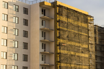 building under construction in scaffolding