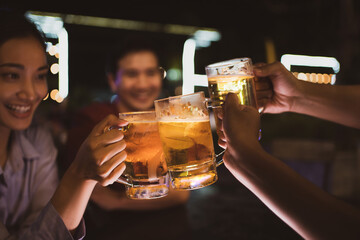 Asian friends Drinking beer outdoors at the brewery for the New Year festival