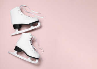 Pair of skates on color background, flat lay. Space for text