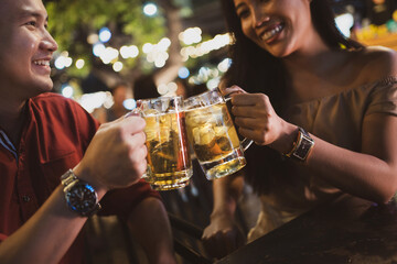 Asian friends Drinking beer outdoors at the brewery for the New Year festival