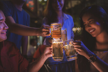 Asian friends Drinking beer outdoors at the brewery for the New Year festival