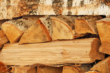 Birch wood stacked in a woodpile close up