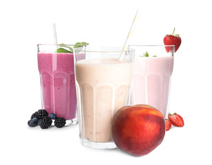 Three tasty milk shakes on white background