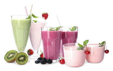 Different tasty milk shakes on white background