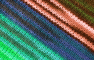 Top View of Multi-color Striped Alpaca Knitted Wool Fabric Texture in Diagonal Patterns for Background or Banner