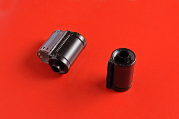 Reels for photographic film of the middle of the last century on a red background close-up