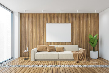 Mockup canvas frame over white sofa in wooden living room with big window