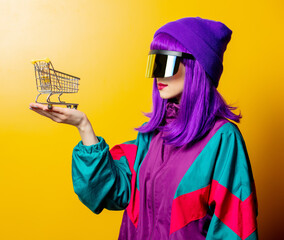 Style woman in VR glasses and 80s tracksuit with shoping cart
