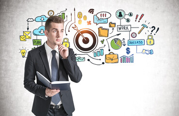 Man with book and his business goal