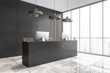 White marble reception room with desk and computers in office lobby