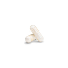 Close-up of a couple pills or capsules color yellow on isolated white background.