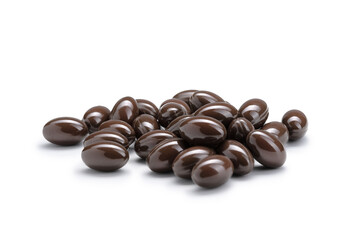 Close-up of a pile of brown colored pills or capsules on isolated white background. Selective Focus.