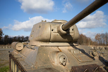 Old aged soviet tank from second world war - armored fighting vehicle. Turret detail. Shallow focus.