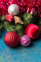 Holiday decorations and evergreen branches left on the table.