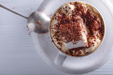 Hot chocolate and marshmallow sprinkled with chocolate chips.