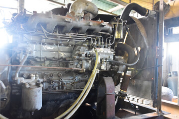 An ancient generator for using in the gas station when a power cut, which is still working today,...