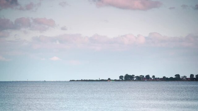 Seascape at evening. Baltic Sea, Puck Bay with Rewa village on horizin, Poland. Nature landscape.