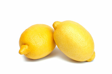 Two fresh, ripe lemon on a white background