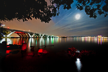 The Woodrow Wilson Memorial Bridge spans the Potomac River between Alexandria, Virginia, and the...
