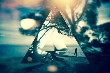 Artistic triangle bokeh landscape with a person taking a photo
