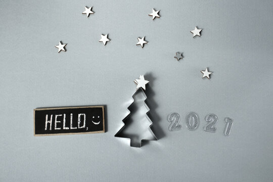 Hello 2021. Christmas tree and stars on a white background
