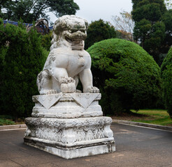 Sculpture of stone lion in front of Entrance Gate to Dr. Sun Yat-Sen Mausoleum at foot of Purple Mountain in Nanjing, Jiangsu. Father of Modern China & founder of Republic of China. Heritage.