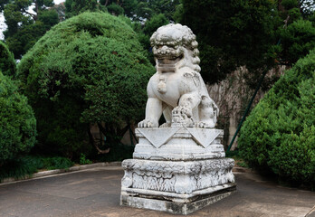 Sculpture of stone lion in front of Entrance Gate to Dr. Sun Yat-Sen Mausoleum at foot of Purple Mountain in Nanjing, Jiangsu. Father of Modern China & founder of Republic of China. Heritage.