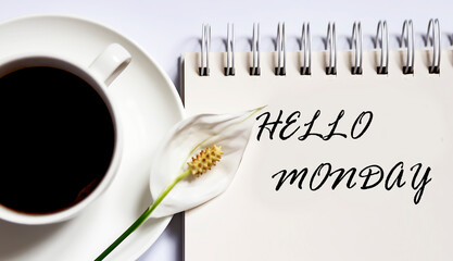 Hello monday , planning concept. notebook with text on white background with coffee