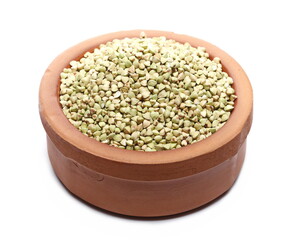 Buckwheat pile in clay pot isolated on white background