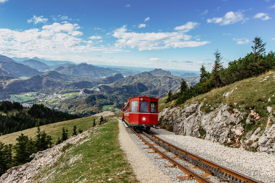 SCHAFBERGBAHN Cog Railway running from St. Wolfgang up the Schafberg, Austria.Journey to the top of Alps through lush fields and green forests.Beautiful mountain panorama.View of lake Wolfgangsee