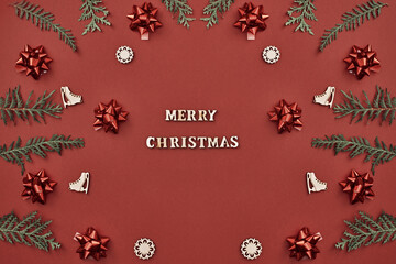Fototapeta na wymiar New Year's decor and inscription Merry Christmas on a red background. Copy space, flat lay, mock up, top view