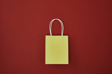 Gift bags on a red background. Copy space, flat lay, mock up, top view