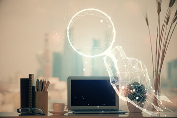 Desktop computer background in office and start up theme hologram drawing. Double exposure. Startup concept.