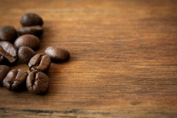 Arabica coffee beans on the wooden.