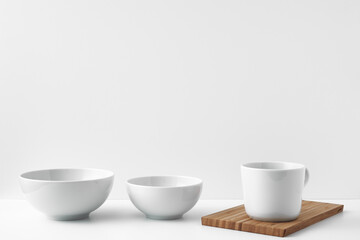 Three circles stand on a white surface against a white background. Copy space, mock up.