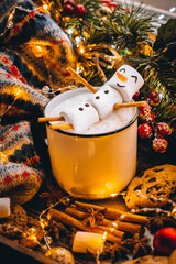 Christmas food white cup with hot chocolate snowman marshmallows. cinnamon sticks fir xmas tree...