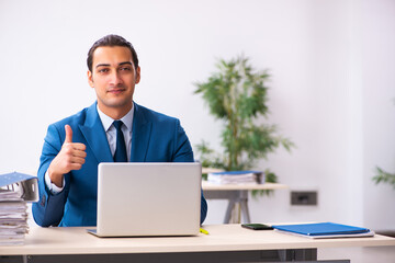 Young businessman employee sitting in the office