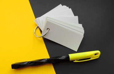 blank sheets of Notepad are held together with a metal ring , mockup, pen and black yellow...