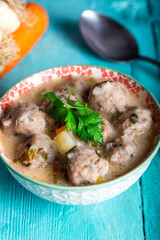 Traditional Turkish sour meatball soup. Vegetable soup with meatballs and sour cream.