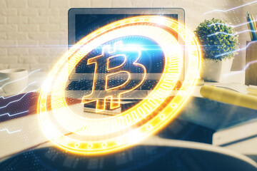 Multi exposure of blockchain and crypto economy theme hologram and table with computer background....